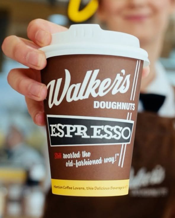 Walker's takeaway Coffee cup held at the food truck